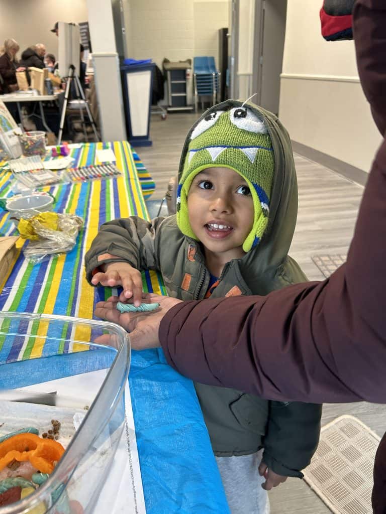 Boy smiling at camera.